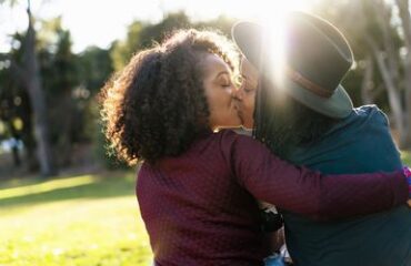lesbian-couple-kissing-in-the-park-639554901-5a690019ff1b7800370a1a66.jpg